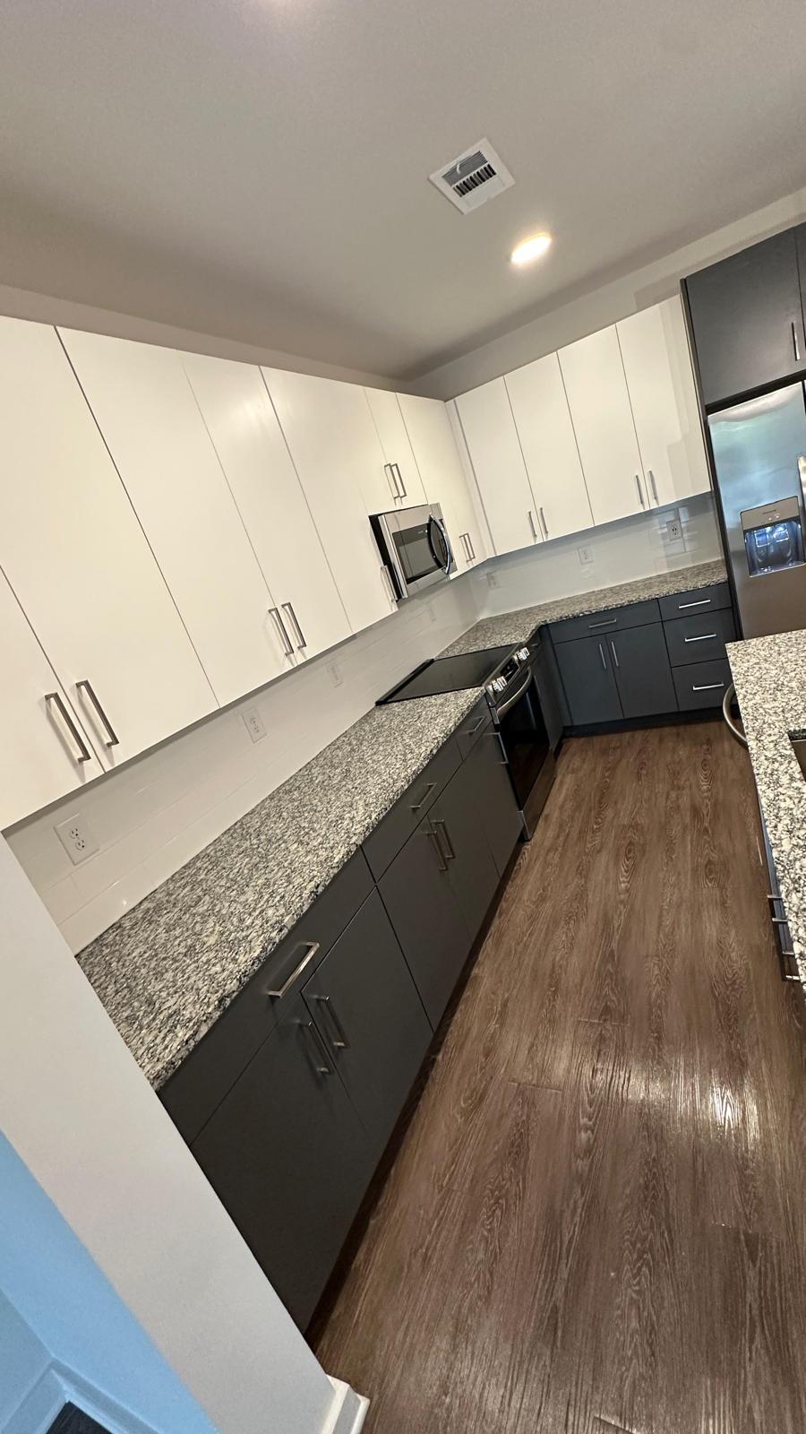 Professional black kitchen cabinet painting and refinishing by DJ7 Solutions
