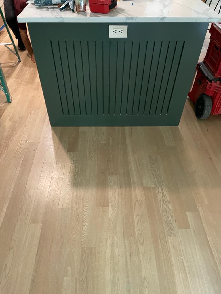 Multifamily apartment flooring replacement extending through living room and kitchen
