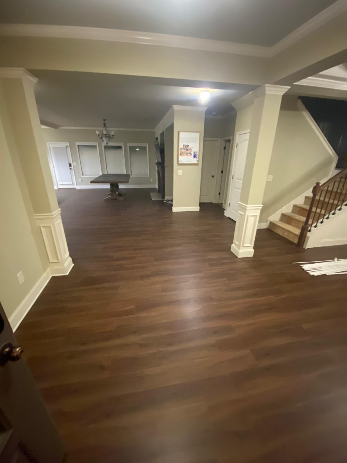 Unit interior before and after plank flooring installation