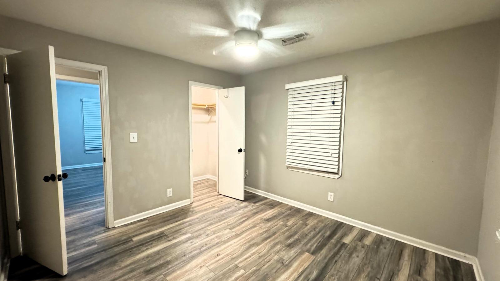 Completed apartment bedroom flooring installation by DJ7 Solutions