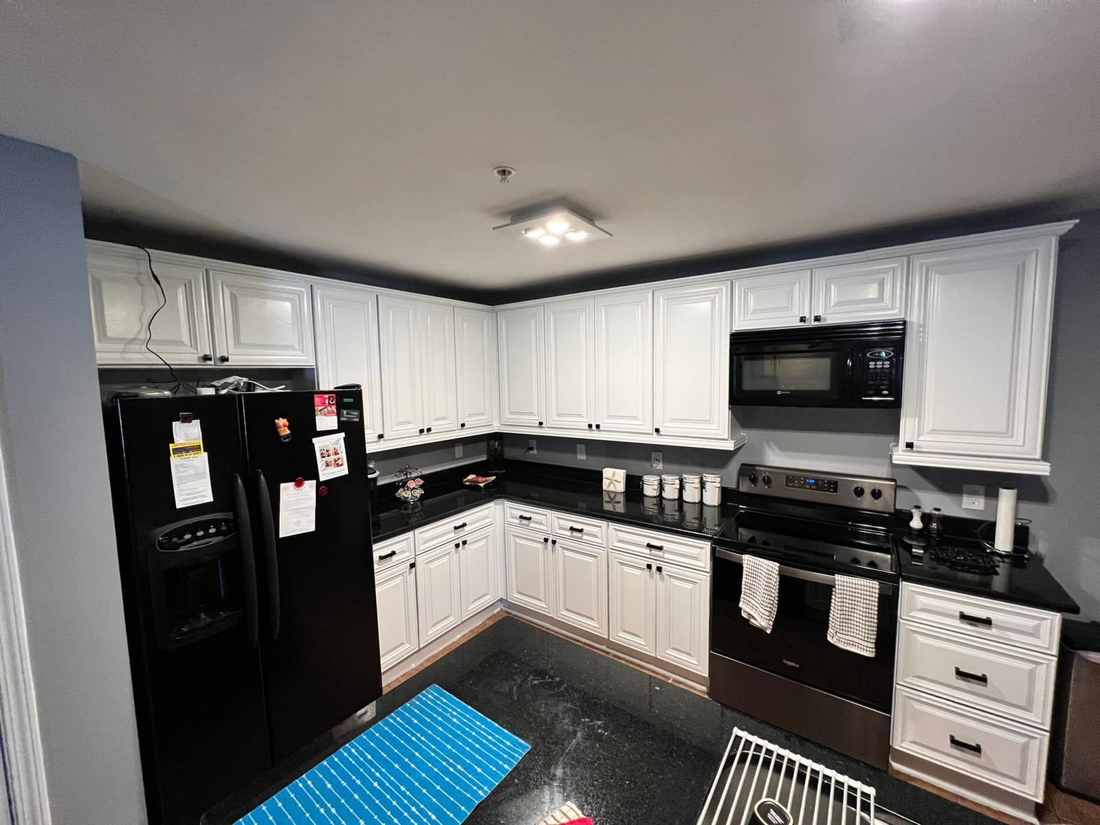 Apartment kitchen cabinets before and after painting
