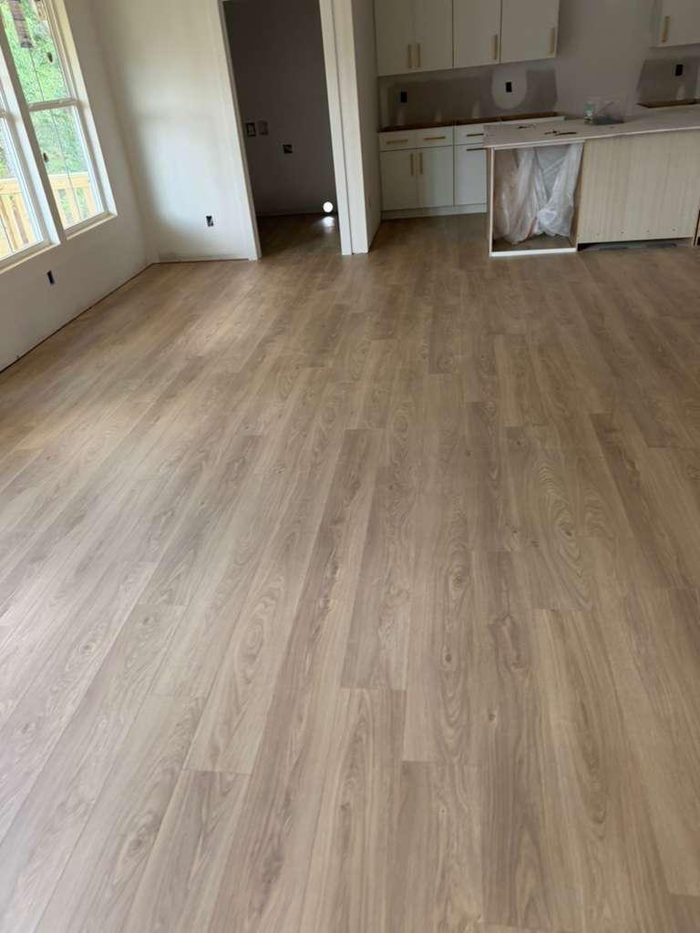 LVP flooring replacement in multifamily apartment living area by DJ7 Solutions