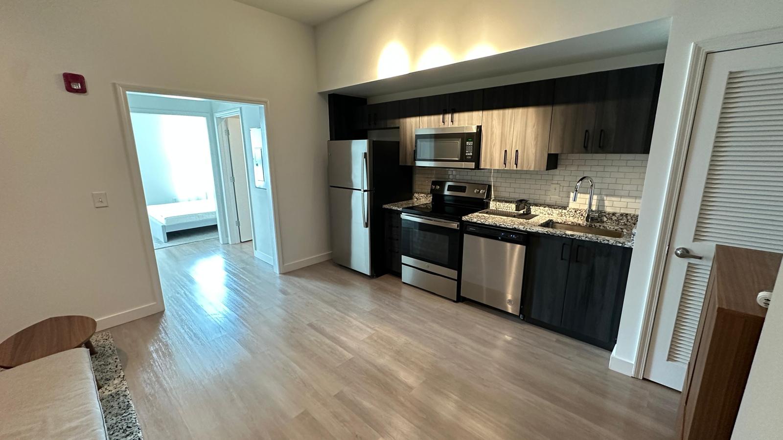 Apartment unit kitchen completed by DJ7 Solutions after punch-out details