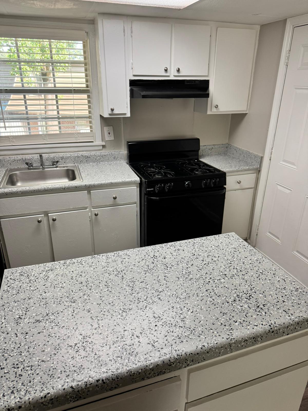 Kitchen cabinet painting and countertop resurfacing for apartment turnover