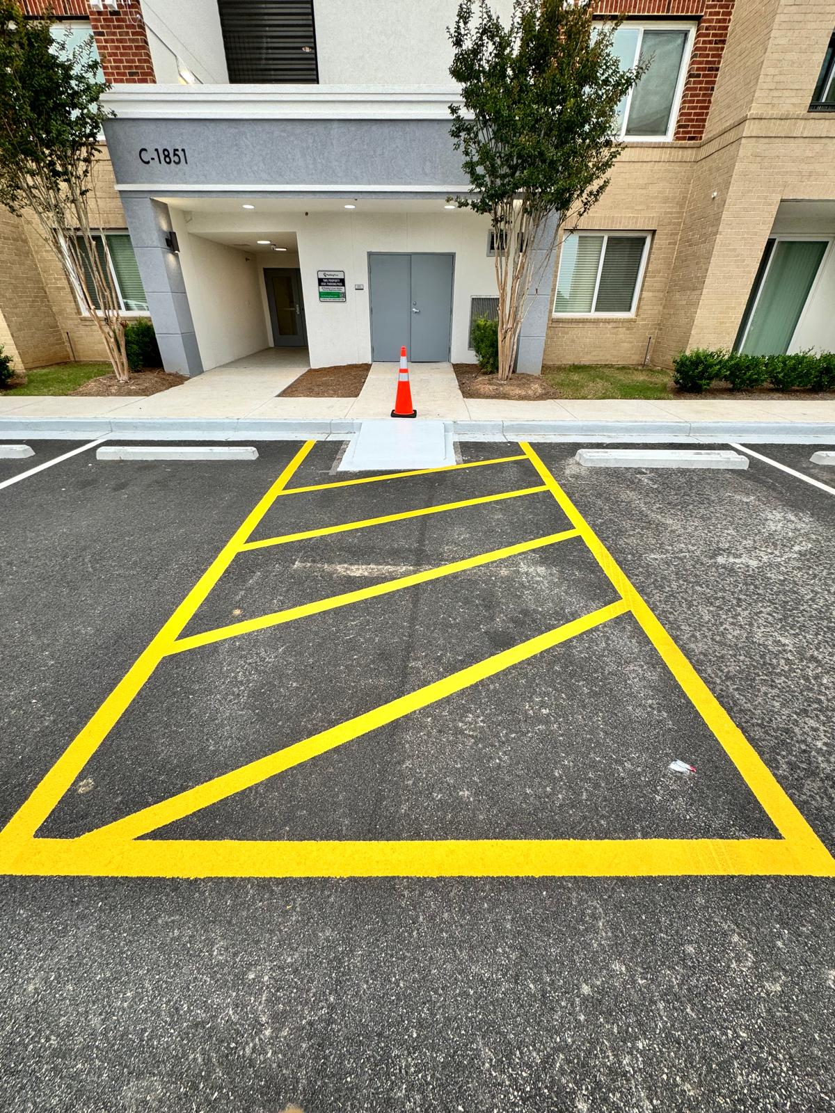 Parking lot layout preparation and completed pavement markings — after
